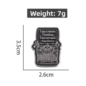 Detailed view of typewriter enamel pin showing 3.5cm x 2.6cm size and 7g weight