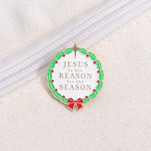 Pin's émaillé couronne de Noël avec texte Jesus is the Reason for the Season sur toile