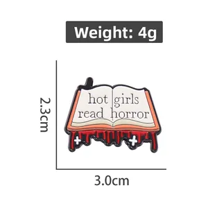 Detailed view of Hot Girls Read Horror book enamel pin with 3.0cm by 2.3cm measurements