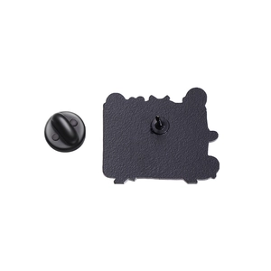 Detail of the black matte metal pin back with secure rubber clutch attachment