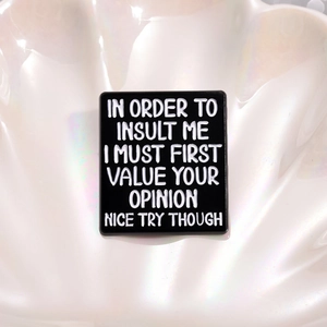 Black rectangle enamel pin with white sarcastic text on pearl texture background