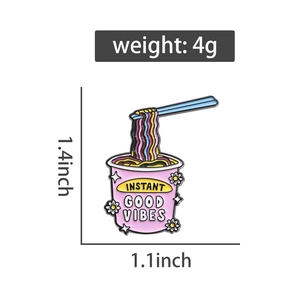 Detail of pink instant noodles enamel pin with Instant Good Vibes text and 1.4 inch dimensions
