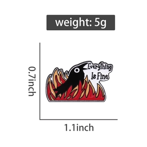 Detail view of zinc alloy enamel pin showing a cartoon crow in fire with dimensions