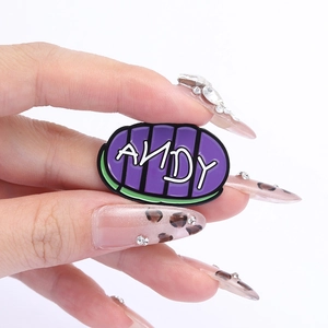 Creative purple striped enamel brooch with white ANDY letter logo on white background