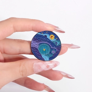 Artistic round enamel pin featuring Van Gogh Starry Night sky and a Hobbit hole door