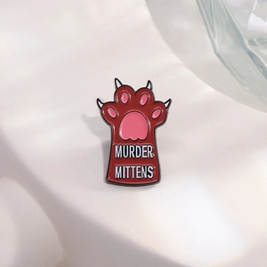 Cartoon cat paw enamel pin with Murder Mittens text in dark red and pink finish