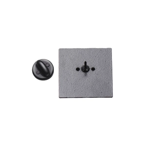 Close-up of matte black metal square badge pin back with butterfly clasp for jewelry