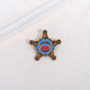 Detail of vintage bronze star brooch with United States Secret Service enamel logo