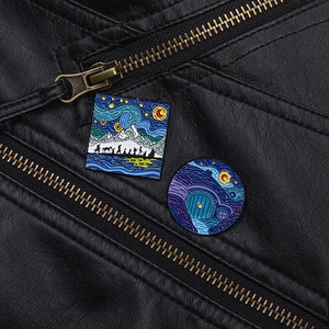 Detail of fantasy landscape enamel pins on leather jacket lapel showing intricate art