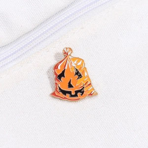 Halloween pumpkin sack enamel pin badge on white canvas background for creative styling