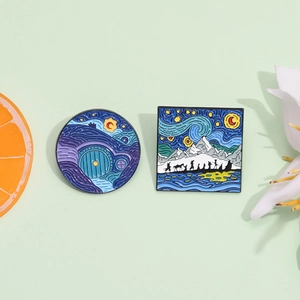 Artistic enamel pins featuring Van Gogh starry night style and Hobbit landscape scenery