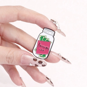 Creative enamel pin featuring a Douchebag Jar design with money inside for accessories