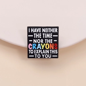 Square enamel pin with I Have Neither The Time Nor The Crayons quote on black background