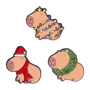 Three-piece Christmas capybara enamel pin set with holiday hats and festive decorations