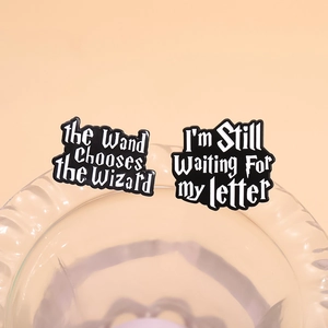 Wizard theme enamel pins set with magic quotes on a light peach background