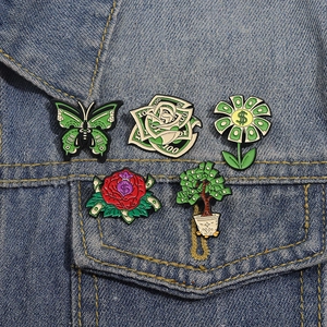 5pcs money-themed enamel pin set with dollar sunflower and butterfly on denim fabric