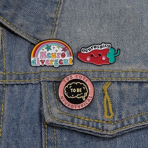 3pcs Neurodiversity enamel pins set featuring rainbow and pepper on denim jacket