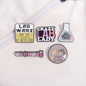5-piece set of cartoon science lab enamel pins with beakers and STEM themes on a canvas bag