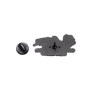Macro shot of Halloween skeleton hand pin back with matte texture and black rubber clutch
