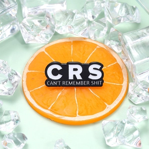 Minimalist black and white enamel CRS pin with humorous text on orange and ice
