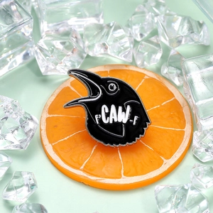 Punk black raven enamel pin with F'CAW-F text on a vibrant green and orange background