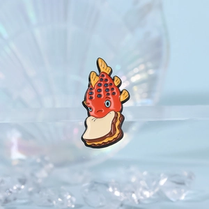 Creative red fish eating sandwich enamel pin with nautical theme shell background