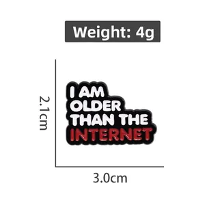 Enamel pin with I Am Older Than The Internet text on black background with size details