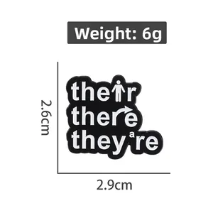 Grammar brooch detail showing 2.6cm x 2.9cm dimensions and 6g product weight