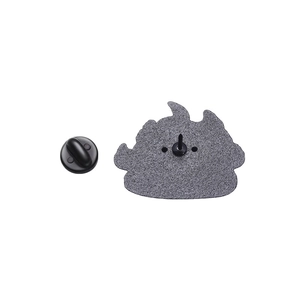 Detail of creative burning angry cat pin with black rubber clutch and textured metal back