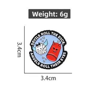 Detailed view of enamel badge featuring winged dice and demon capsule with size specs