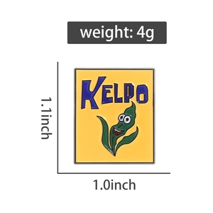 Detail of yellow enamel Kelpo pin with cartoon seaweed character measuring 1.1x1.0 inches