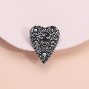 Gothic black metal heart planchette brooch with occult sun, moon and skull engravings