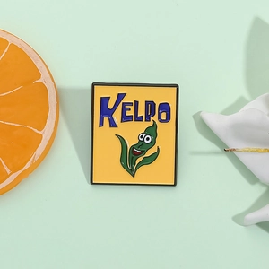 Creative abstract green kelp cartoon enamel pin with blue KELPO text on yellow background