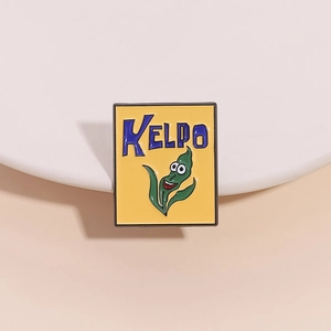 Detailed view of Kelpo cartoon enamel pin on a minimalist white stand with soft shadows