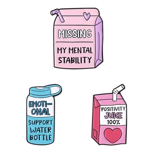 Set of three colorful enamel pins featuring creative juice and milk box designs