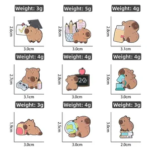 Detailed grid of capybara enamel pins with specific size and weight dimensions