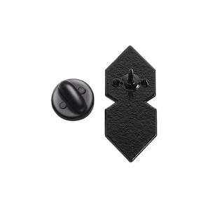 Detail of matte black metal brooch backing with diamond-shaped base and butterfly clasp