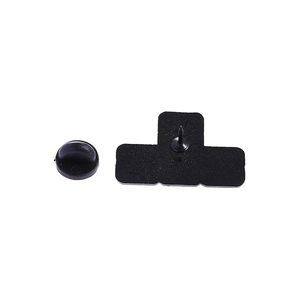 Detail view of the black pixel pin back with its secure rubber clutch fastener