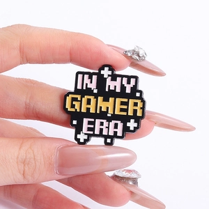 Creative pixel art enamel pin with 'IN MY GAMER ERA' text for bags and clothing