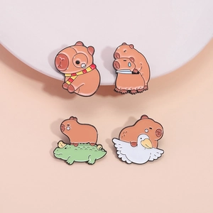 Set of four cute cartoon capybara enamel pins featuring animals on an orange background