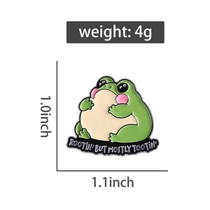 Detail showing dimensions of 1.0x1.1 inches for the cartoon green frog enamel pin badge
