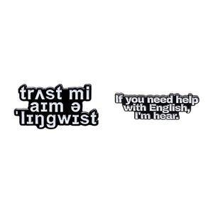 Black enamel linguist pins set featuring phonetic transcription and witty wordplay text