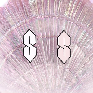 Retro 90s S-shaped enamel pins in pink and white colors with polished metal finish