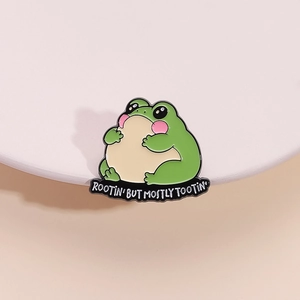 Cute green cartoon frog enamel pin badge with Rootin' Tootin' slogan for backpacks
