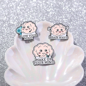 Set of 3 pink enamel brain pins with fun quotes on a pearl shell decorative tray