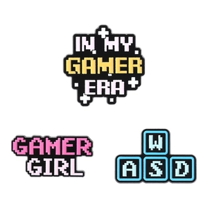 Gamer Era and Gamer Girl pixel art enamel pins set with WASD keys for backpacks