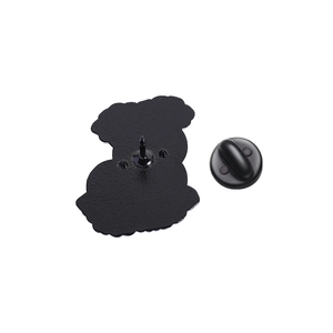 Macro view of the black metal brooch back with secure rubber clutch fastener