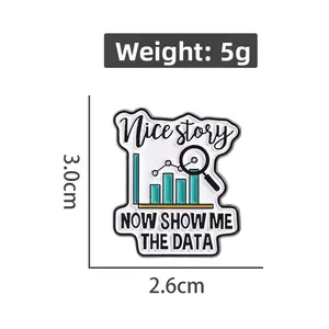 Macro detail of enamel pin with 'Show me the data' text and magnifying glass design