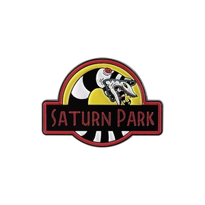 Enamel Saturn Park brooch pin featuring a black and white sandworm creature design