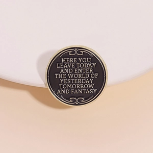 Sci-fi black enamel brooch with gold text Here You Leave Today and Enter Fantasy World